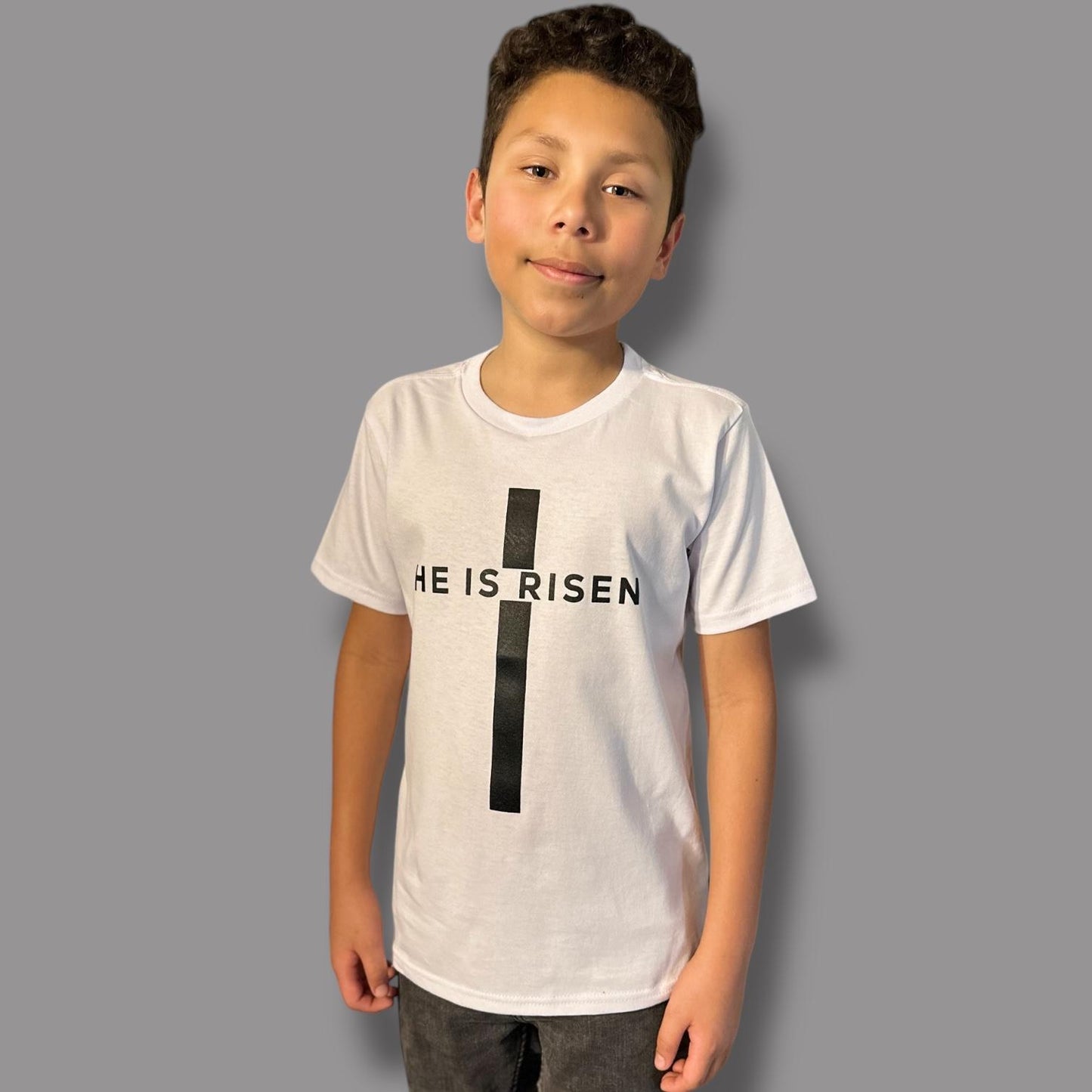 "He is Risen" on Cross kids Christian T-shirt in Black or White
